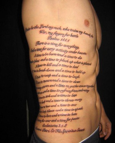 Psalm 144:1 script tattoo reading “Blessed be the Lord, my rock”