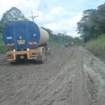 Vehicle stuck on the muddy Miri-Lapok road