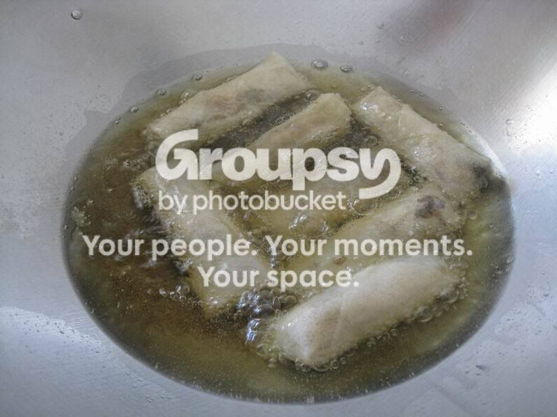 Popiah frying in oil until golden brown